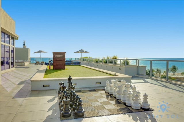 view of patio with a water view