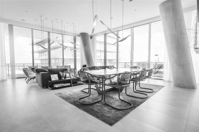 dining space featuring floor to ceiling windows