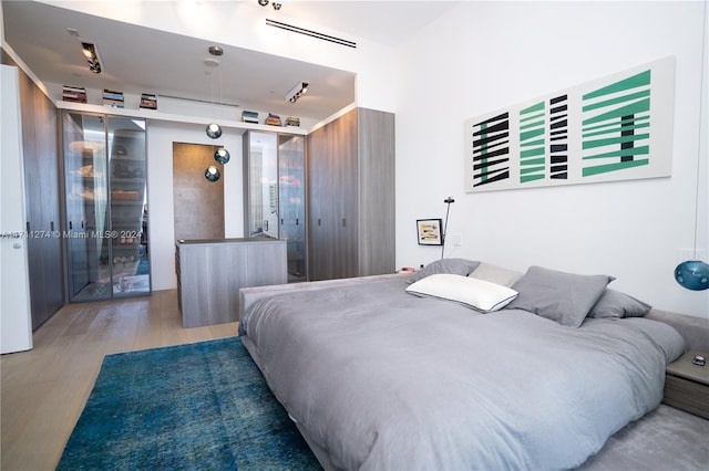 bedroom featuring hardwood / wood-style floors