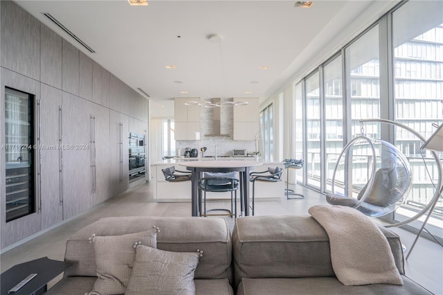 living room featuring plenty of natural light and sink