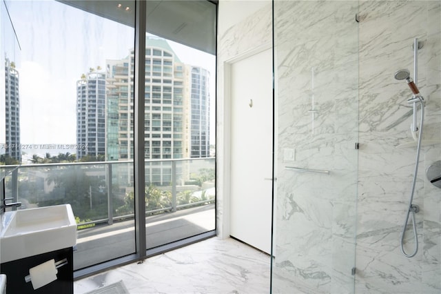 bathroom with vanity and a shower with shower door