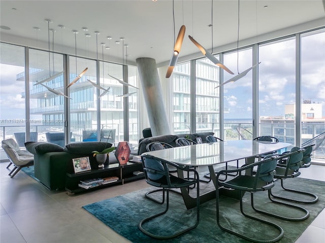 dining area featuring expansive windows and concrete floors