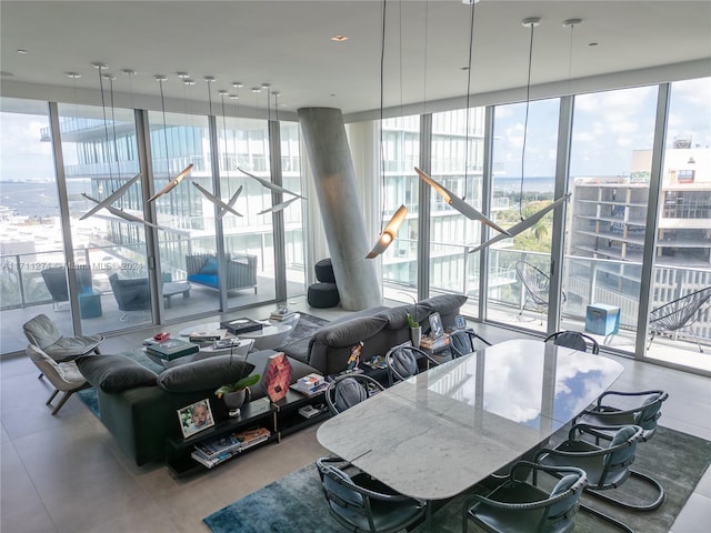 dining space featuring a wall of windows