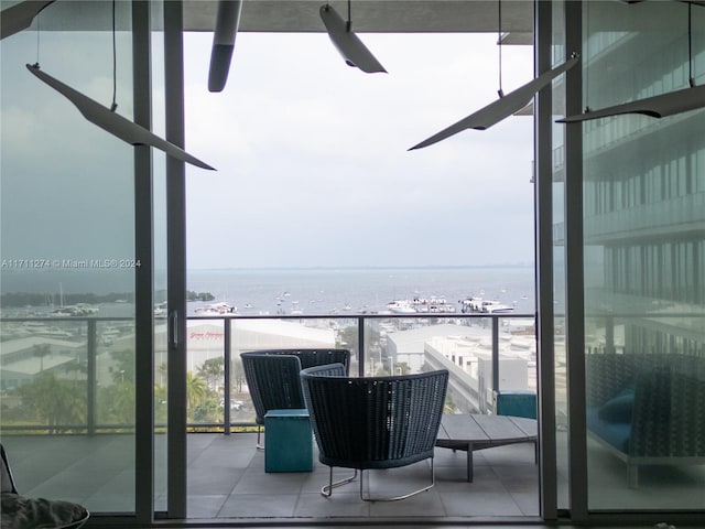 balcony with a beach view and a water view