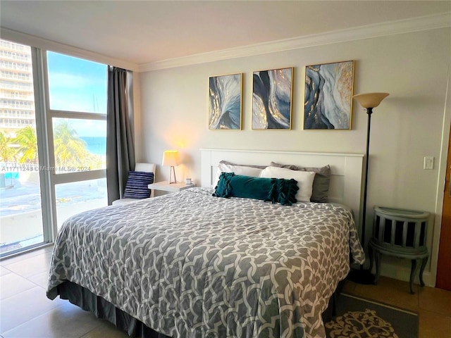 tiled bedroom featuring access to exterior and ornamental molding