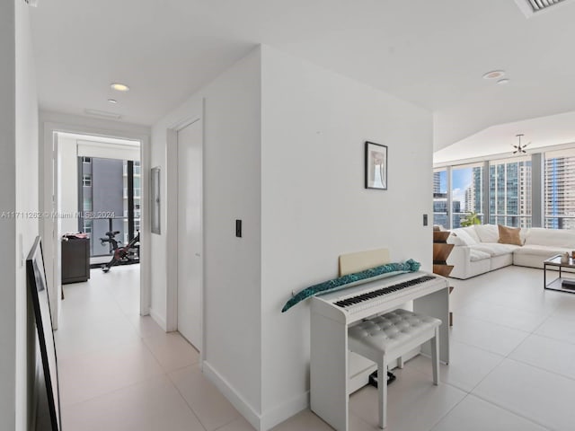 hall featuring light tile patterned flooring