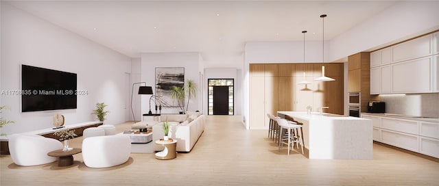 living room featuring light hardwood / wood-style flooring and sink