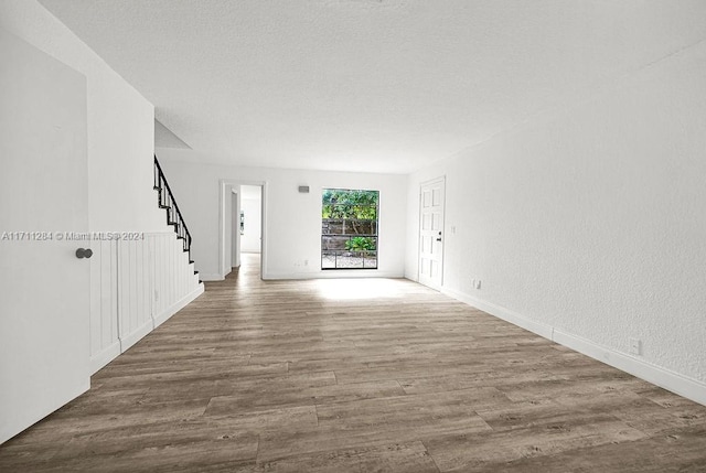 unfurnished room featuring hardwood / wood-style flooring