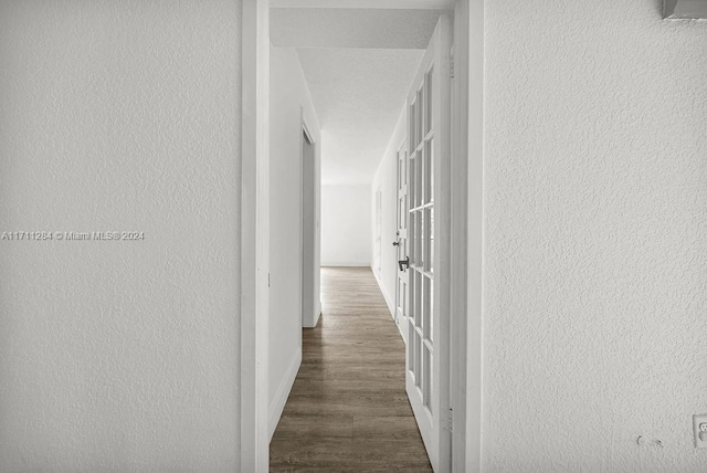 hallway featuring dark hardwood / wood-style floors