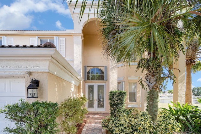 view of exterior entry featuring french doors