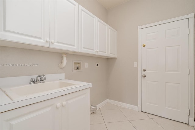 laundry room with sink, cabinets, washer hookup, electric dryer hookup, and light tile patterned floors