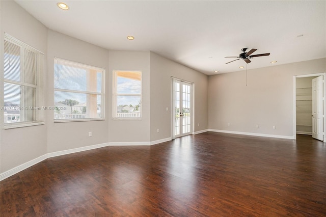 unfurnished room featuring ceiling fan and dark wood-type flooring