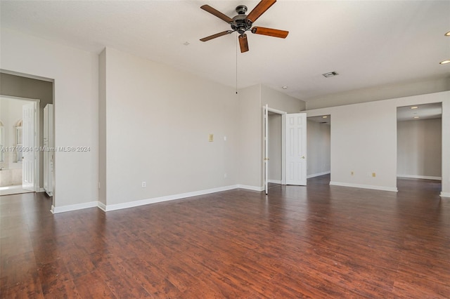 empty room featuring ceiling fan and dark wood-type flooring