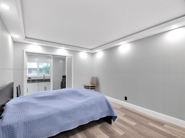 bedroom with light hardwood / wood-style flooring