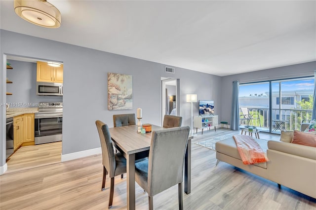 dining area featuring light hardwood / wood-style flooring