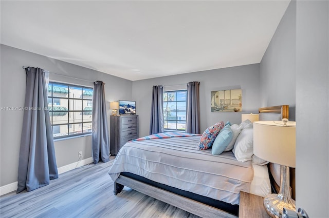 bedroom with light wood-type flooring