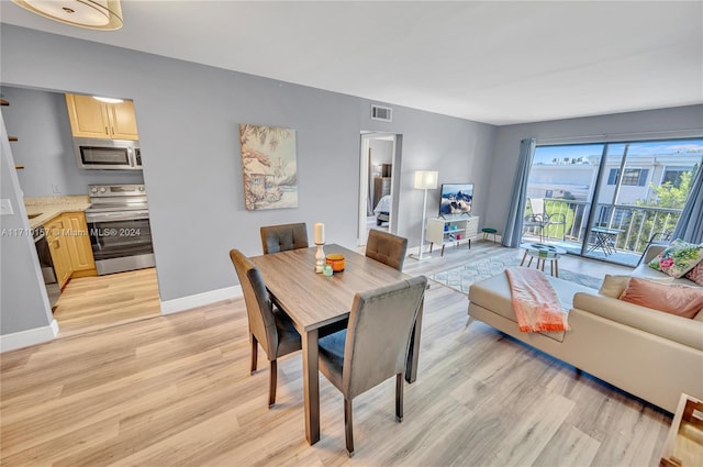 dining room featuring light hardwood / wood-style flooring