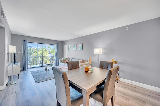 dining room featuring light hardwood / wood-style floors