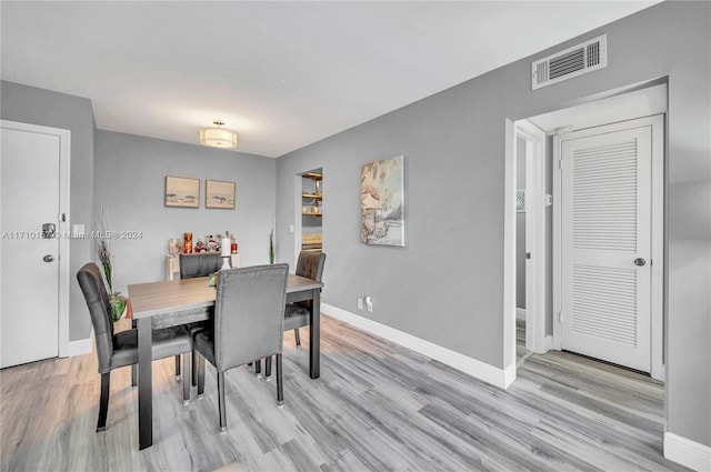 dining space featuring light hardwood / wood-style floors