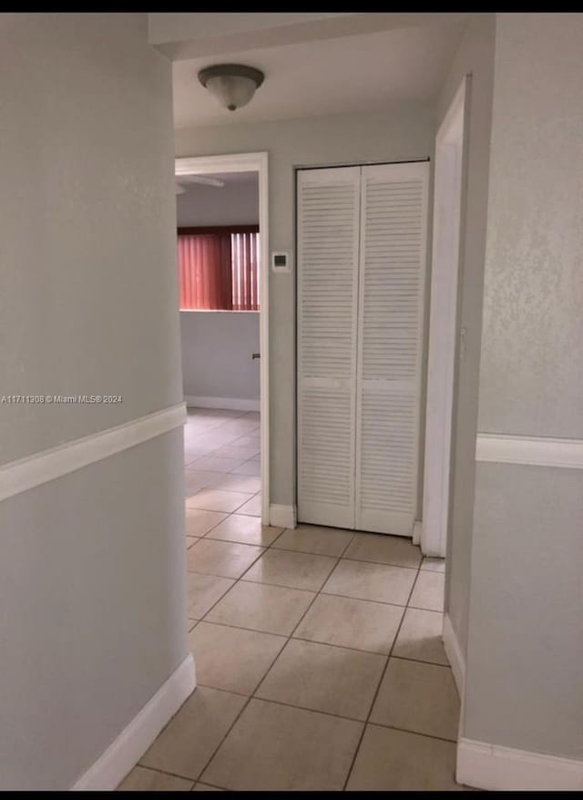 hallway with light tile patterned floors