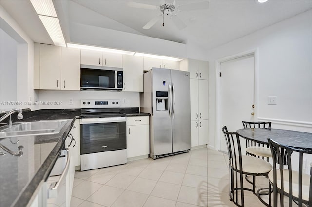 kitchen featuring white cabinetry, sink, ceiling fan, stainless steel appliances, and light tile patterned floors