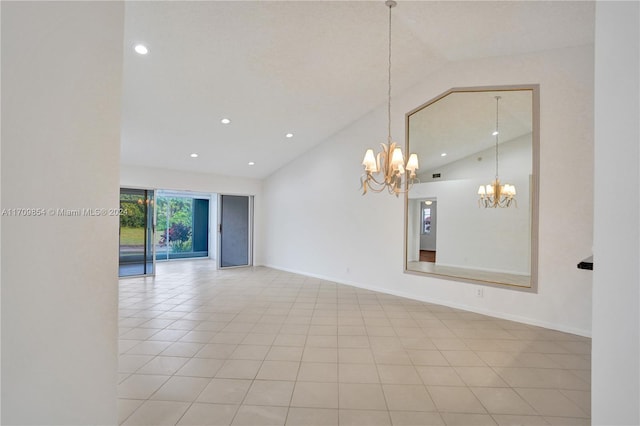 empty room with light tile patterned floors, high vaulted ceiling, and an inviting chandelier