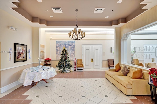 interior space featuring light tile patterned floors and an inviting chandelier