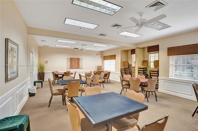 game room featuring ceiling fan and light carpet