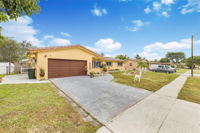 view of front of home featuring a front lawn and a garage