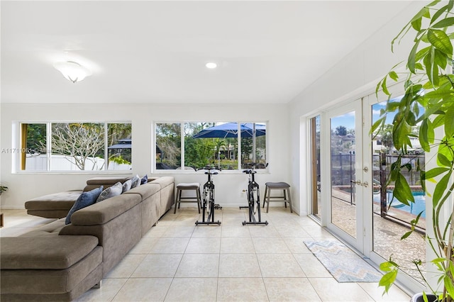 sunroom / solarium featuring french doors