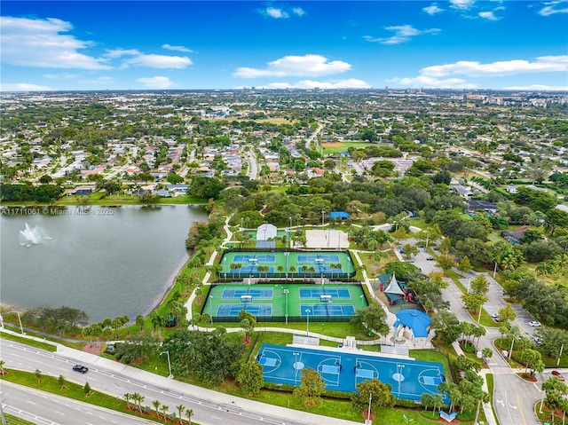 birds eye view of property with a water view