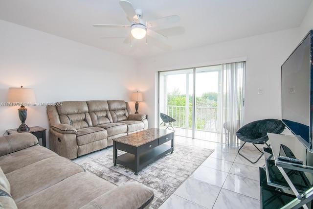 living room with ceiling fan and light tile patterned floors