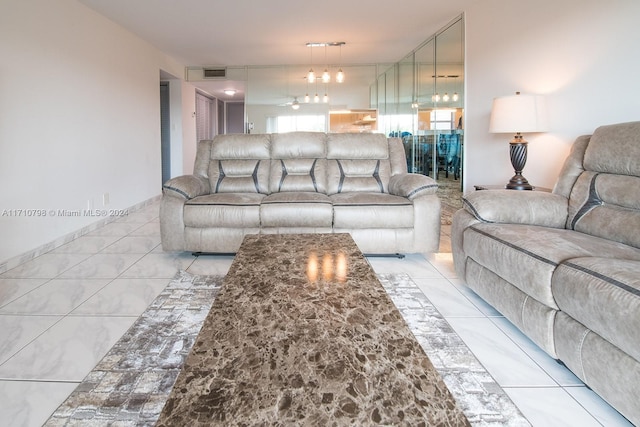 tiled living room featuring ceiling fan