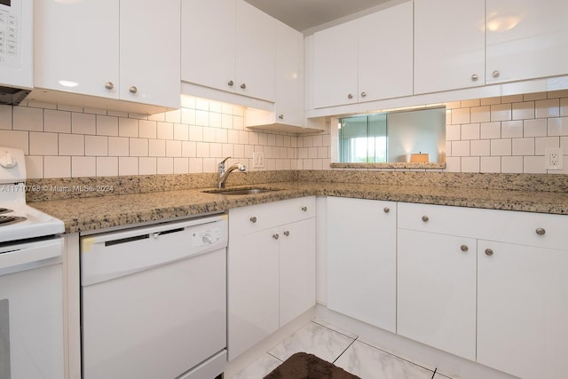 kitchen featuring sink, white cabinets, and white appliances