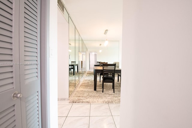 hallway with light tile patterned flooring