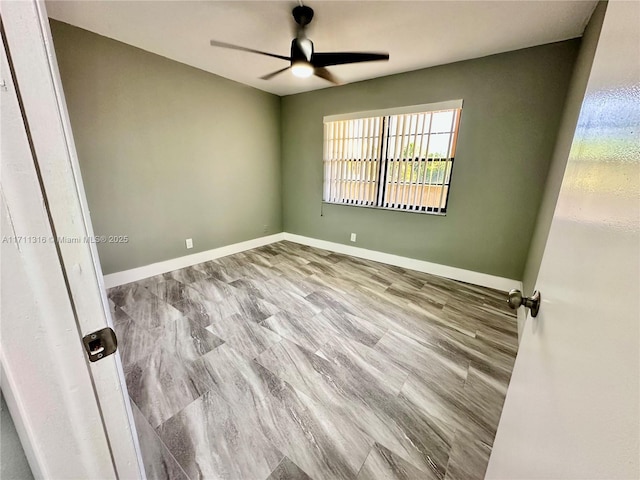 spare room with ceiling fan and light hardwood / wood-style flooring