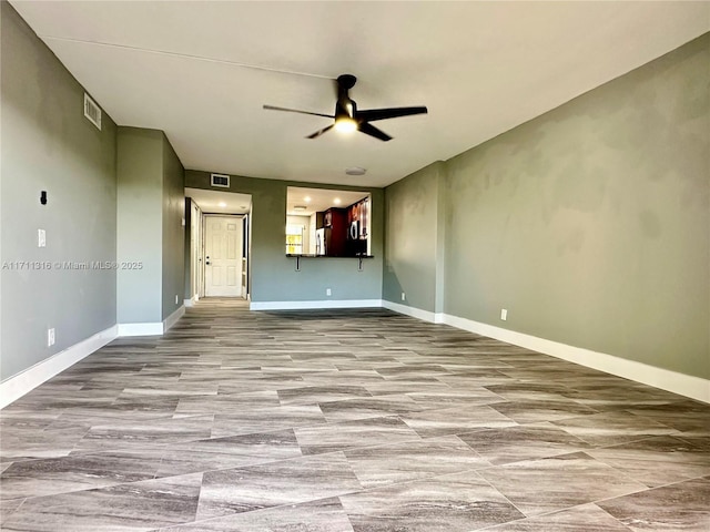 spare room featuring ceiling fan