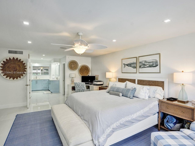 bedroom featuring ceiling fan and ensuite bathroom