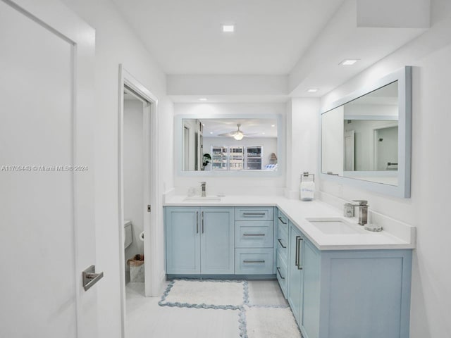 bathroom featuring tile patterned floors, ceiling fan, toilet, and vanity