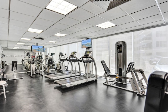 workout area featuring a drop ceiling