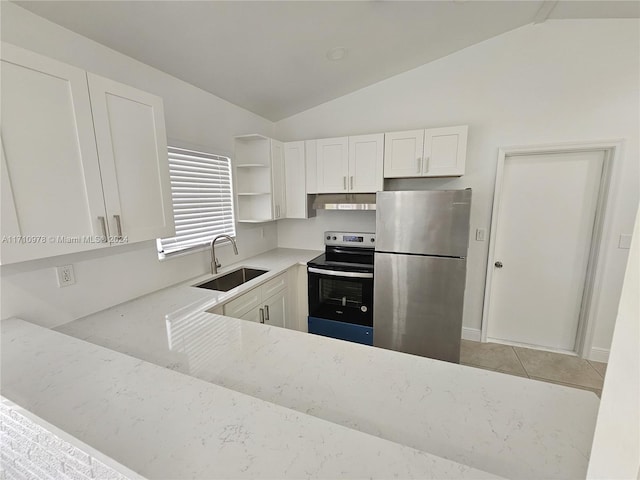 kitchen featuring sink, white cabinetry, stainless steel appliances, and vaulted ceiling