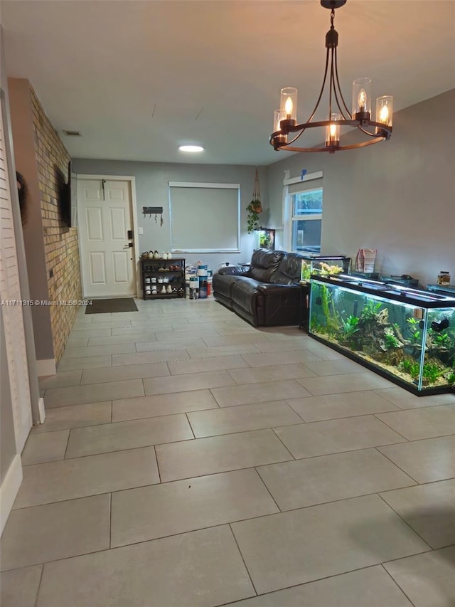 interior space featuring light tile patterned floors and a notable chandelier