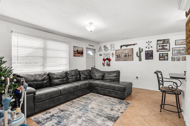 living room featuring light tile patterned flooring, a textured ceiling, and ornamental molding