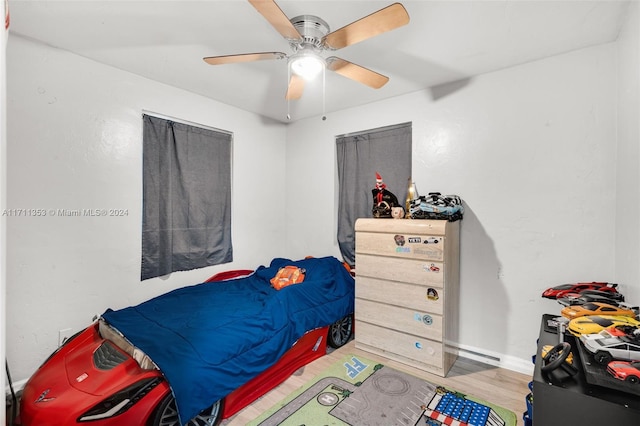 bedroom featuring ceiling fan and hardwood / wood-style floors