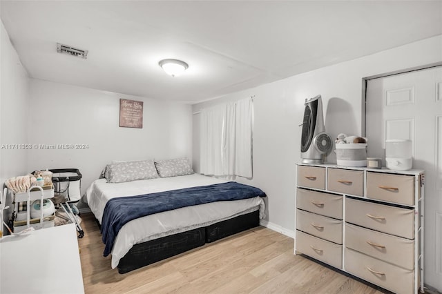 bedroom with light hardwood / wood-style floors