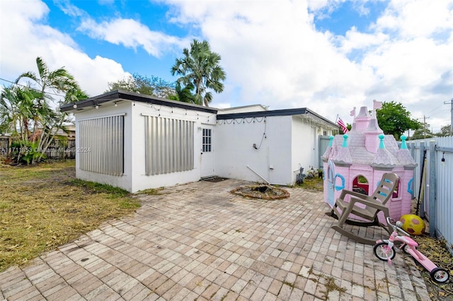 rear view of house featuring a patio