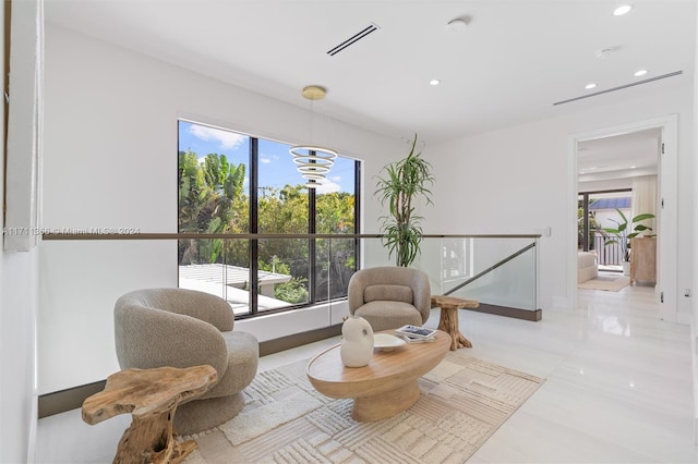 sitting room featuring light tile patterned flooring