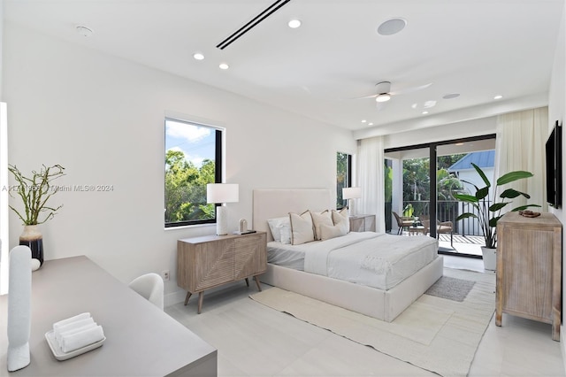 bedroom featuring ceiling fan, access to exterior, and multiple windows