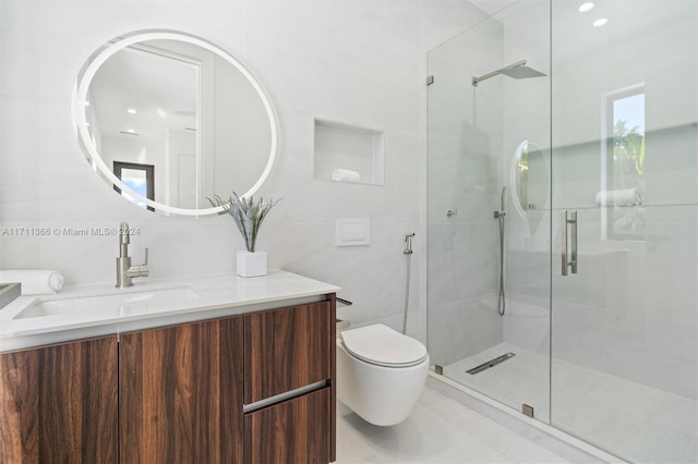 bathroom with vanity, tile patterned floors, toilet, tile walls, and an enclosed shower