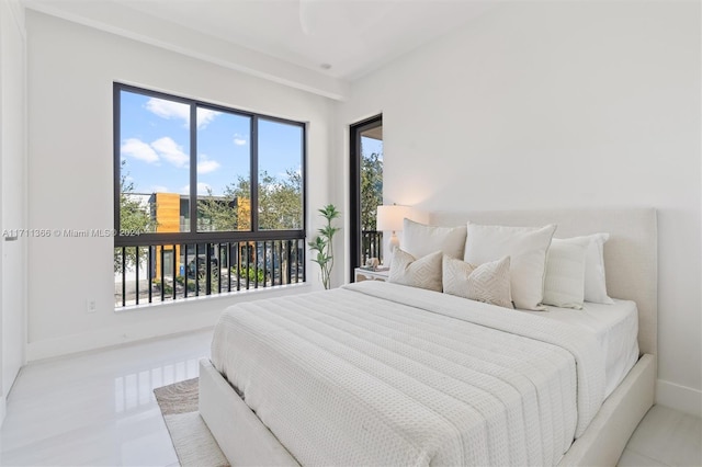 bedroom with light tile patterned floors